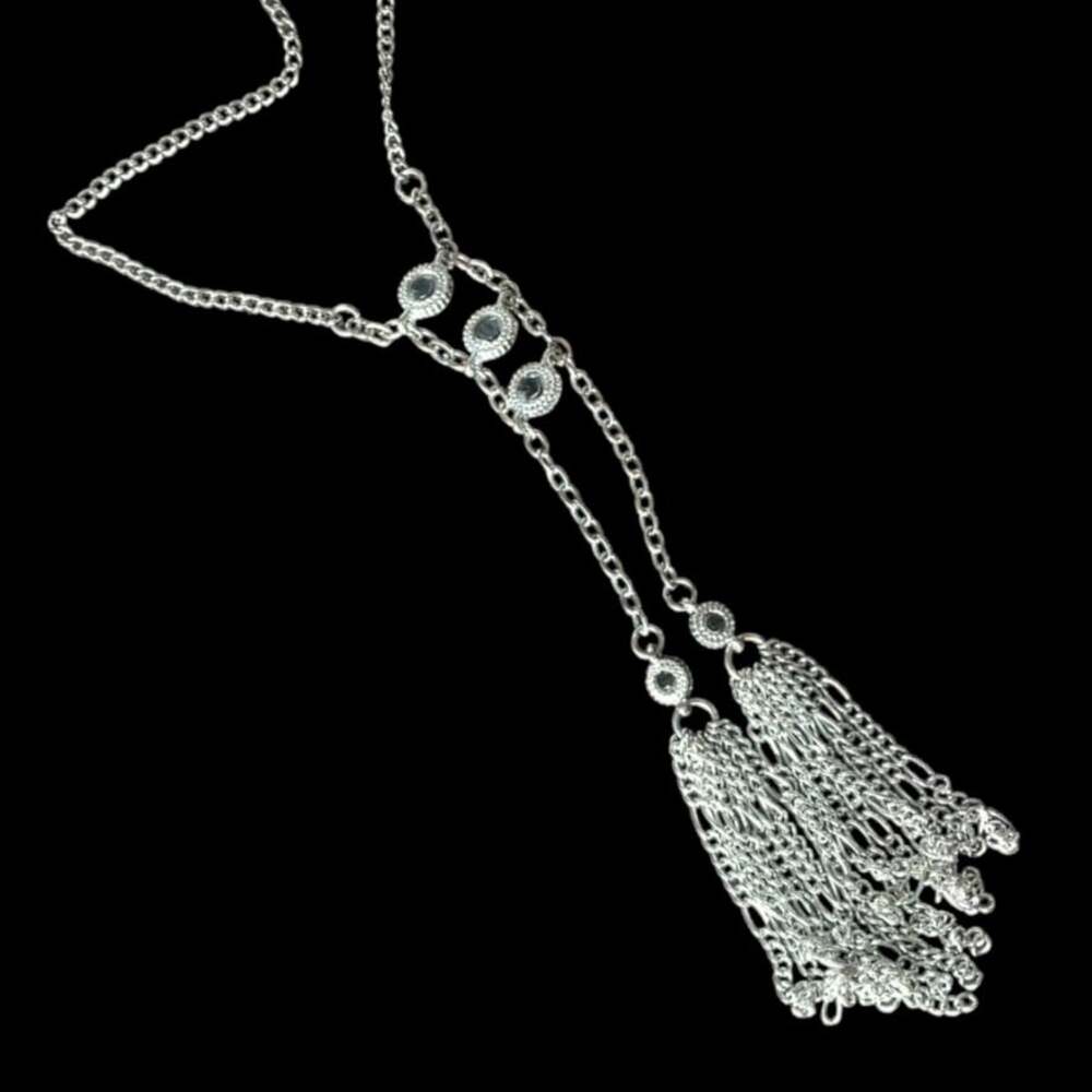 Bright silver tone faceted crystal accent dramatic tassel necklace